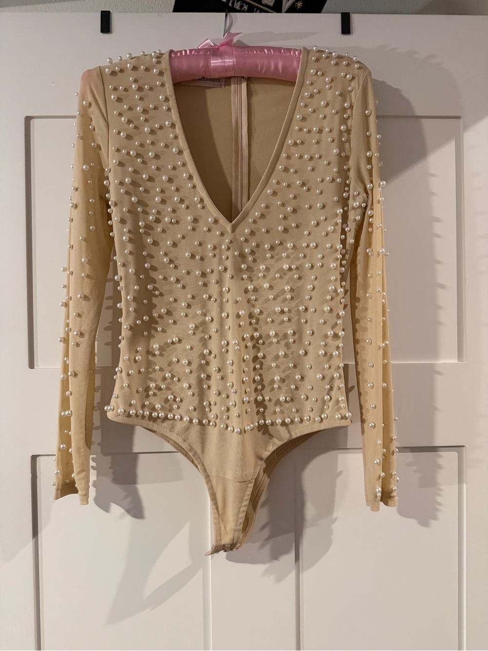 Shop Kultivate Beaded Pearl Accent Long-Sleeve Bodysuit - Cream. Never worn